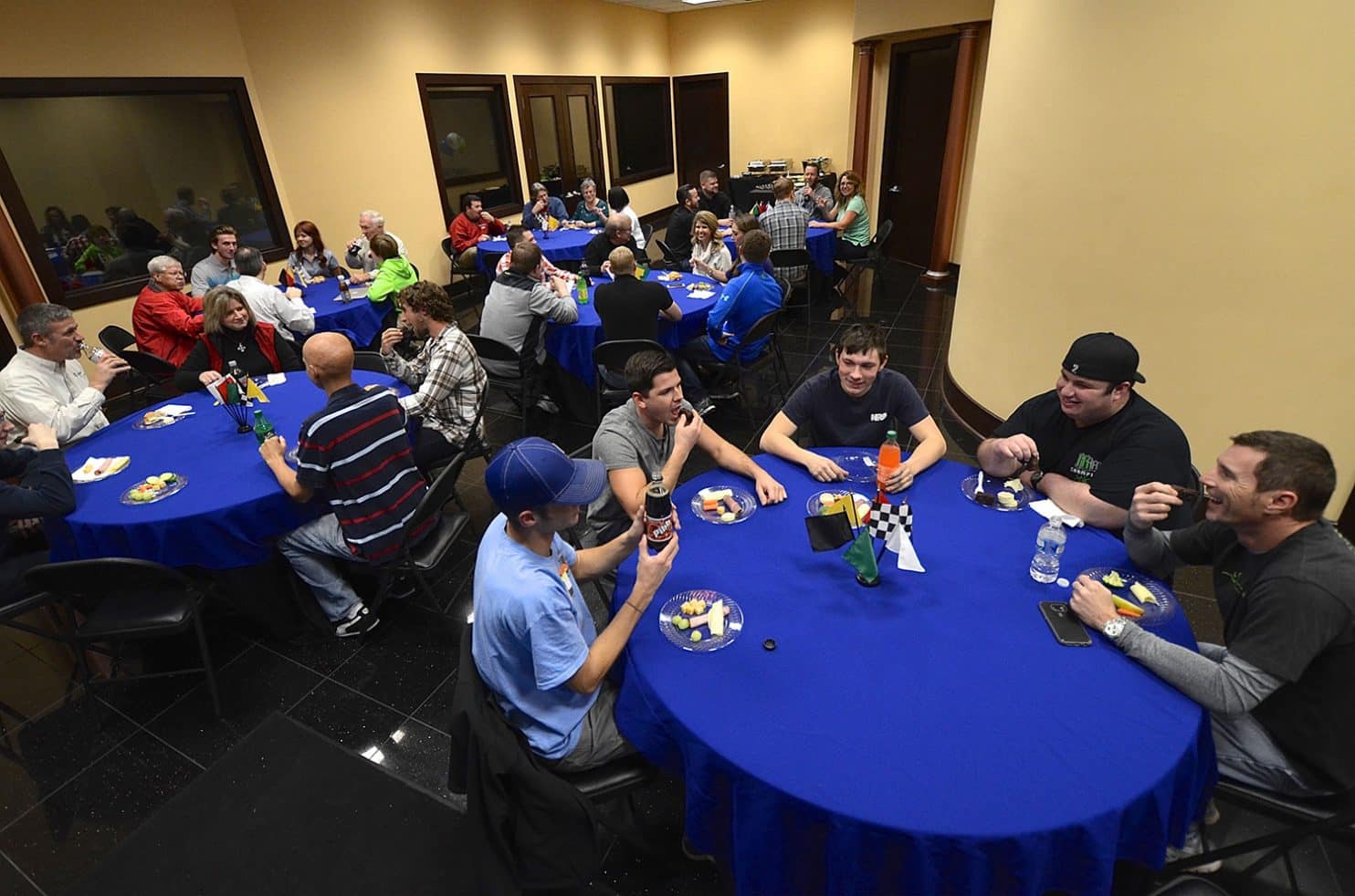 Bluegrass room with several tables and people sitting around them